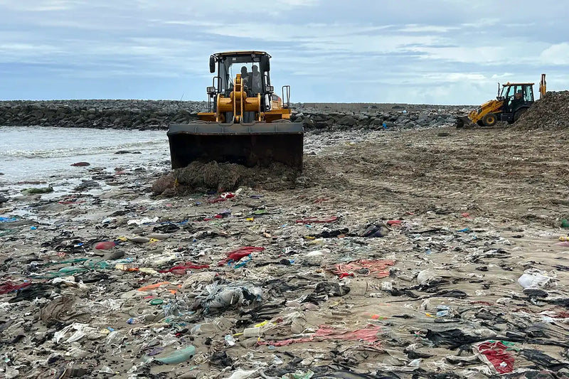 Mayekoo tractor and Beach Rake removing waste from a polluted shoreline in Ghana