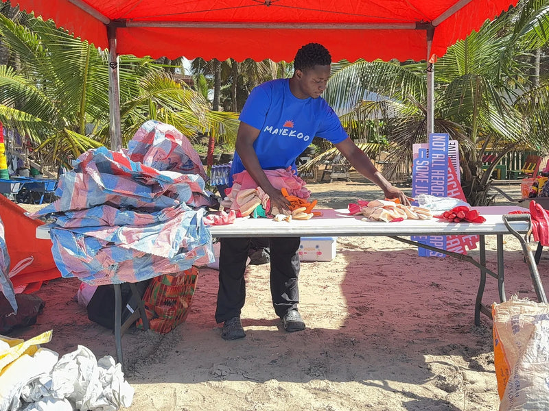 Volunteers check in station at a Mayekoo beach cleanup in Accra, Ghana